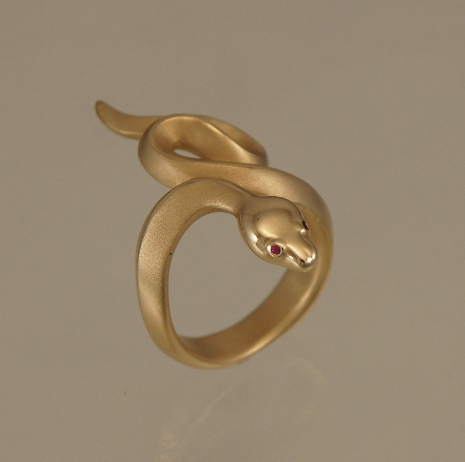 boa snake ring, bronze, ruby or blue sapphire eyes