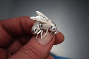 silver bee pin / pendant  with blue sapphire eye