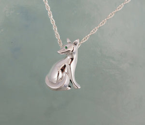 sitting kit fox pendant ,   silver.  pick finish and eye color