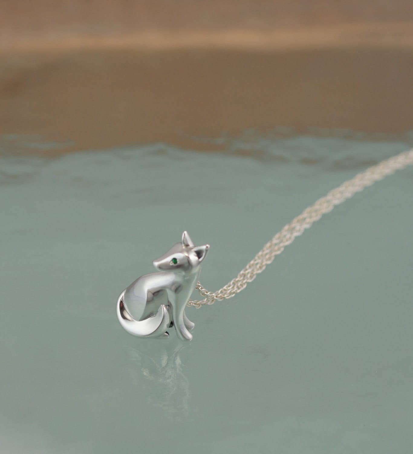 sitting kit fox pendant ,   silver.  pick finish and eye color