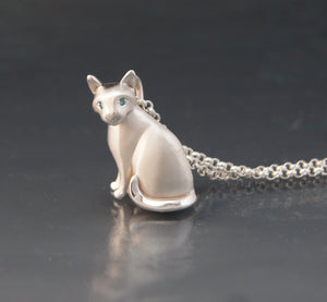 sitting CAT .  diamond eyes