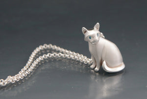sitting CAT .  diamond eyes