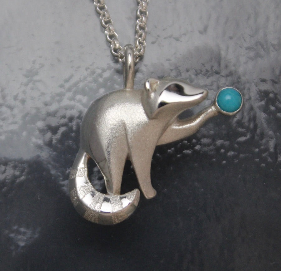 silver raccoon pendant with turquoise