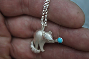 silver raccoon pendant with turquoise