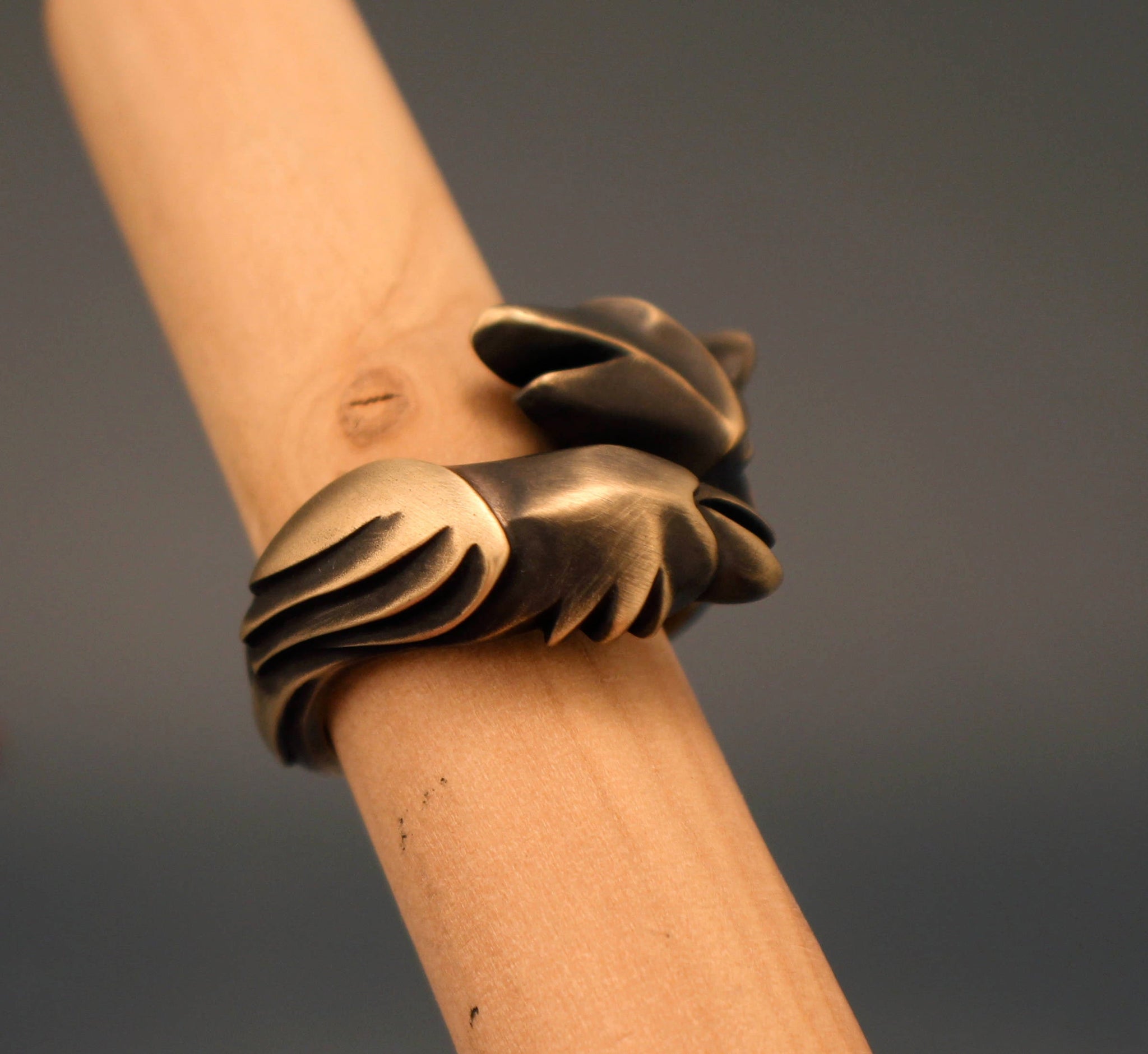 raven and wolf ring with classic bronze finish
