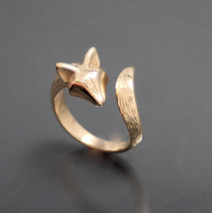bronze furred baby coyote