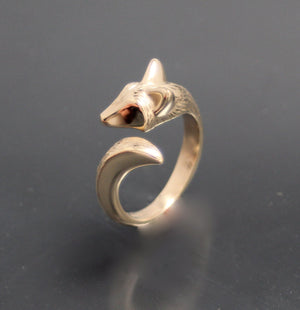 bronze furred baby coyote