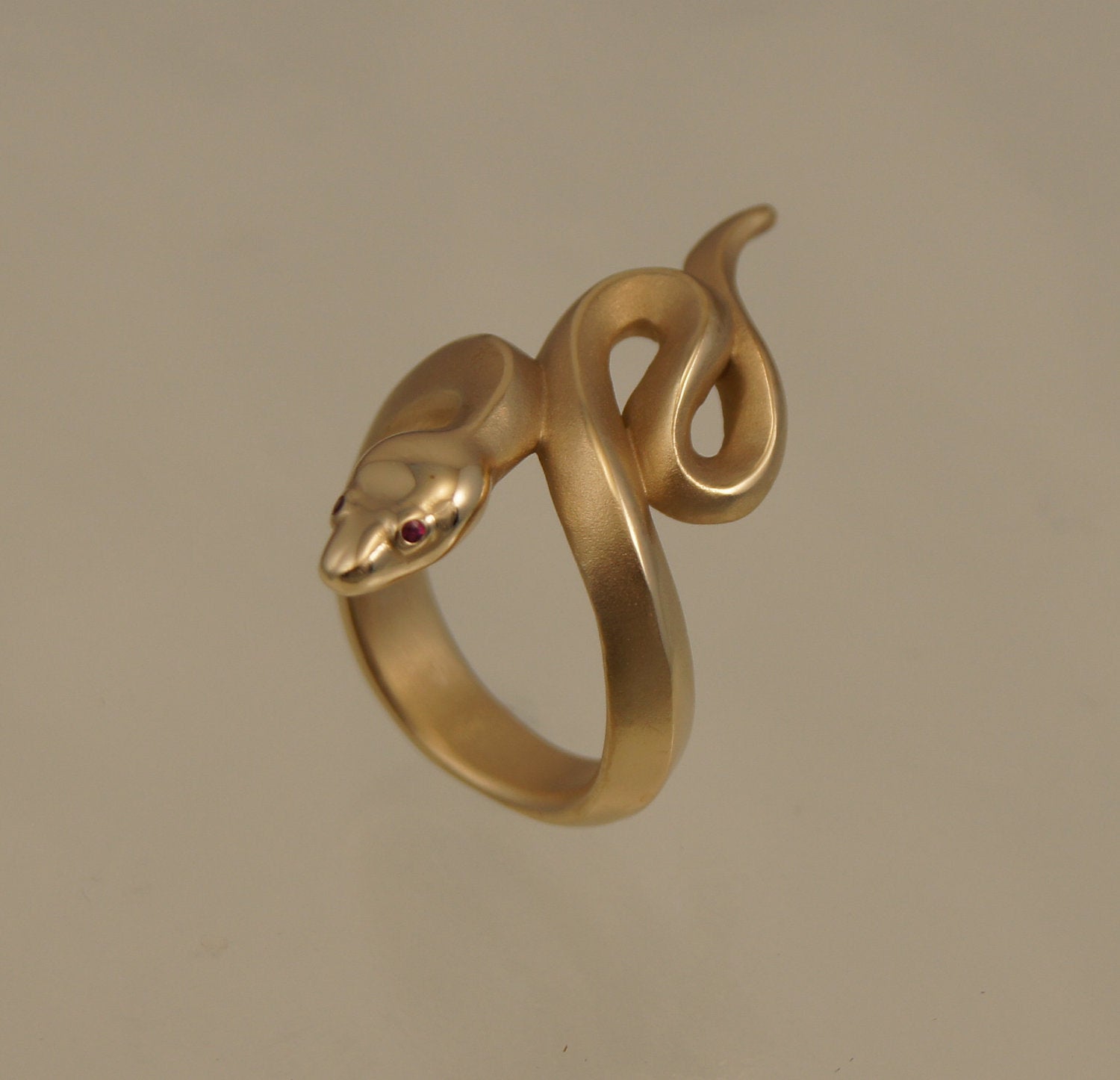 boa snake ring, bronze, ruby or blue sapphire eyes