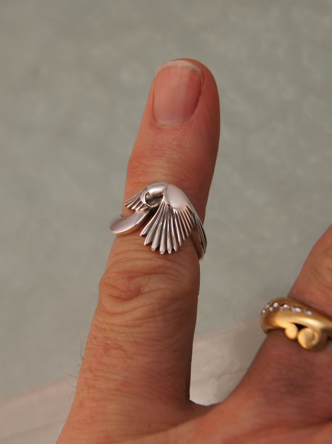 silver parrot ring, 10% of purchase goes to Nebraska Parrot Rescue
