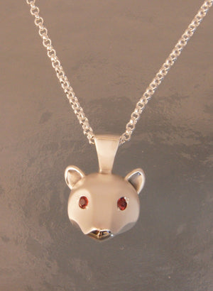 silver grizzly bear pendant with gemstone eyes